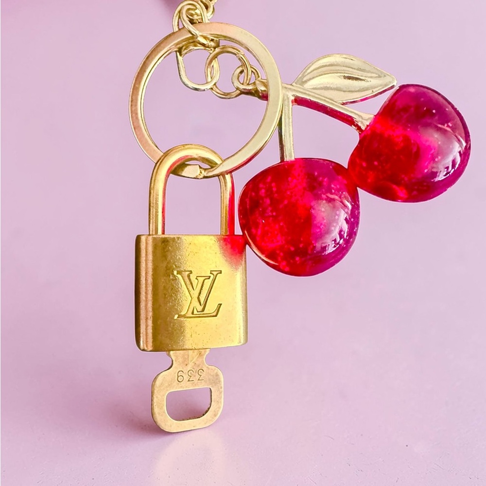 Authentic Louis Vuitton Padlock with unbranded Cherry bag charm